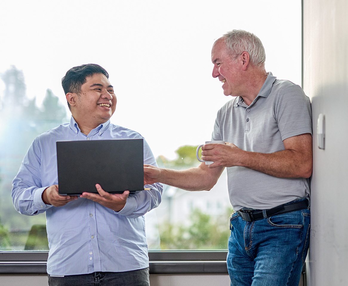 Two coworkers enjoying working together